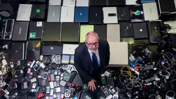 The Royal Society of Chemistry's chief executive Robert Barker, pictured with some of the redundant tech gathered by staff at the organisation’s Cambridge HQ during an amnesty